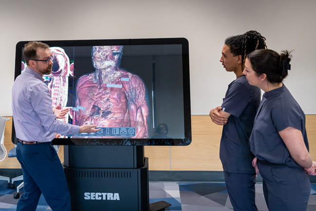 OT faculty and students observe VR anatomy simulator