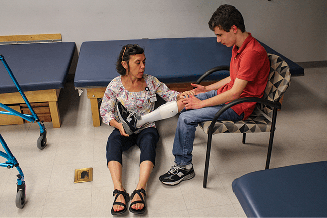 Physical therapist assists a patient