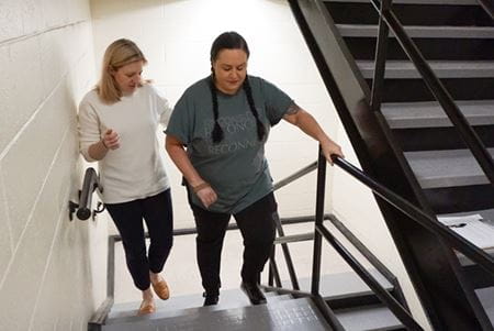 woman climbing stairs