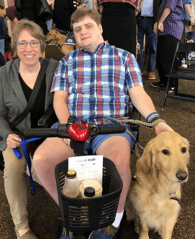 Michelle Woodbury, with Alyx and his new service dog, Thatcher.