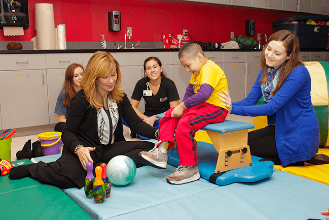 Occupational therapist working with a pediatric patient