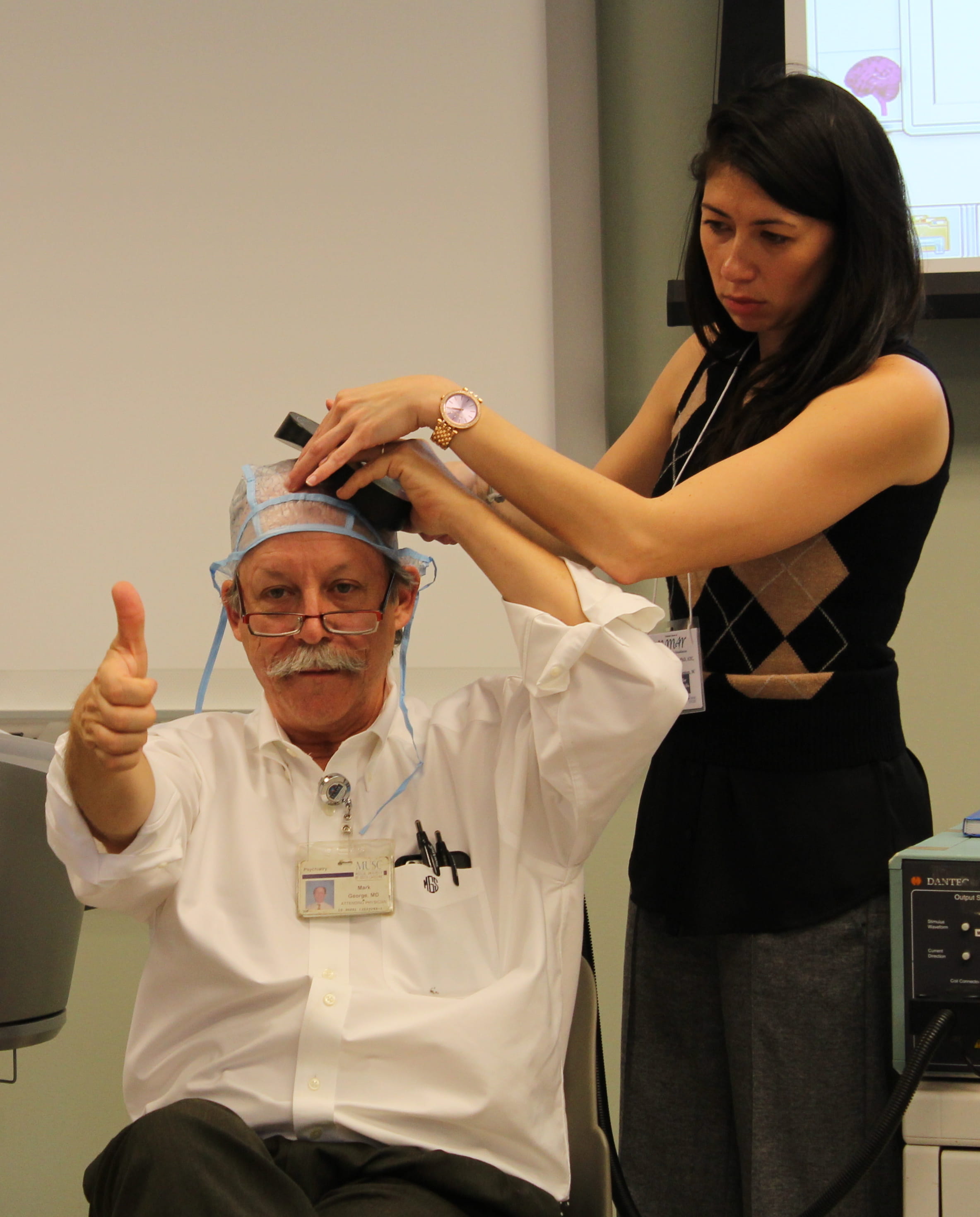 Demonstration of finding motor threshold with transcranial magnetic stimulation 