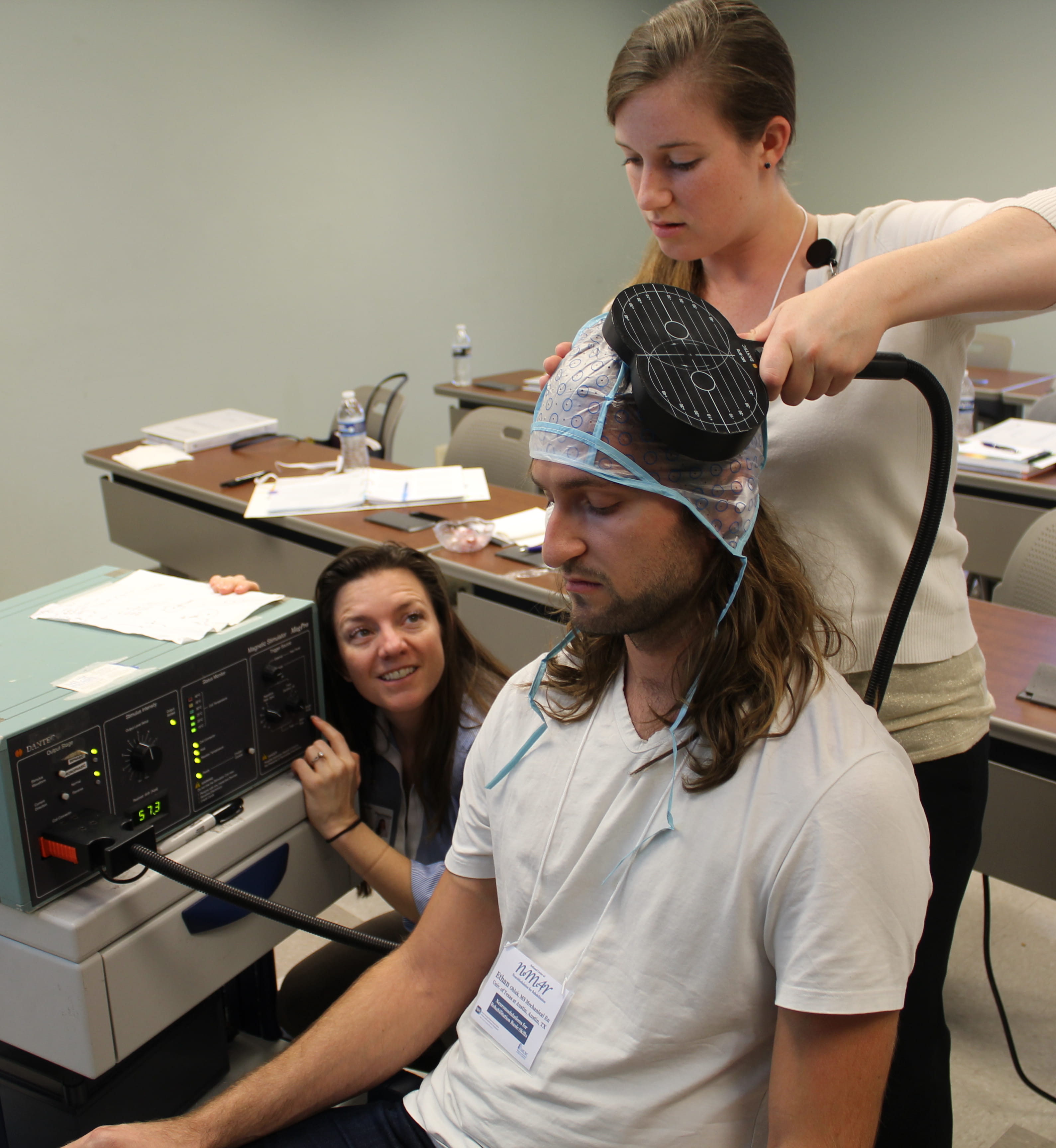 Training attendees in using transcranial magnetic stimulation during the introductory workshop.